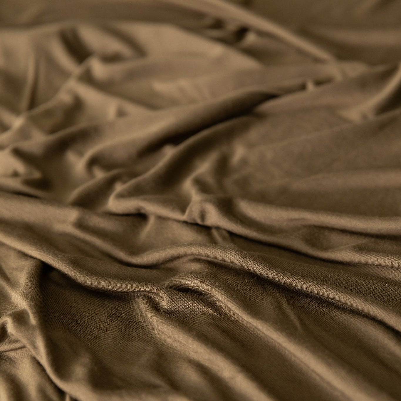 Close-up of crumpled brown jersey knit fabric
