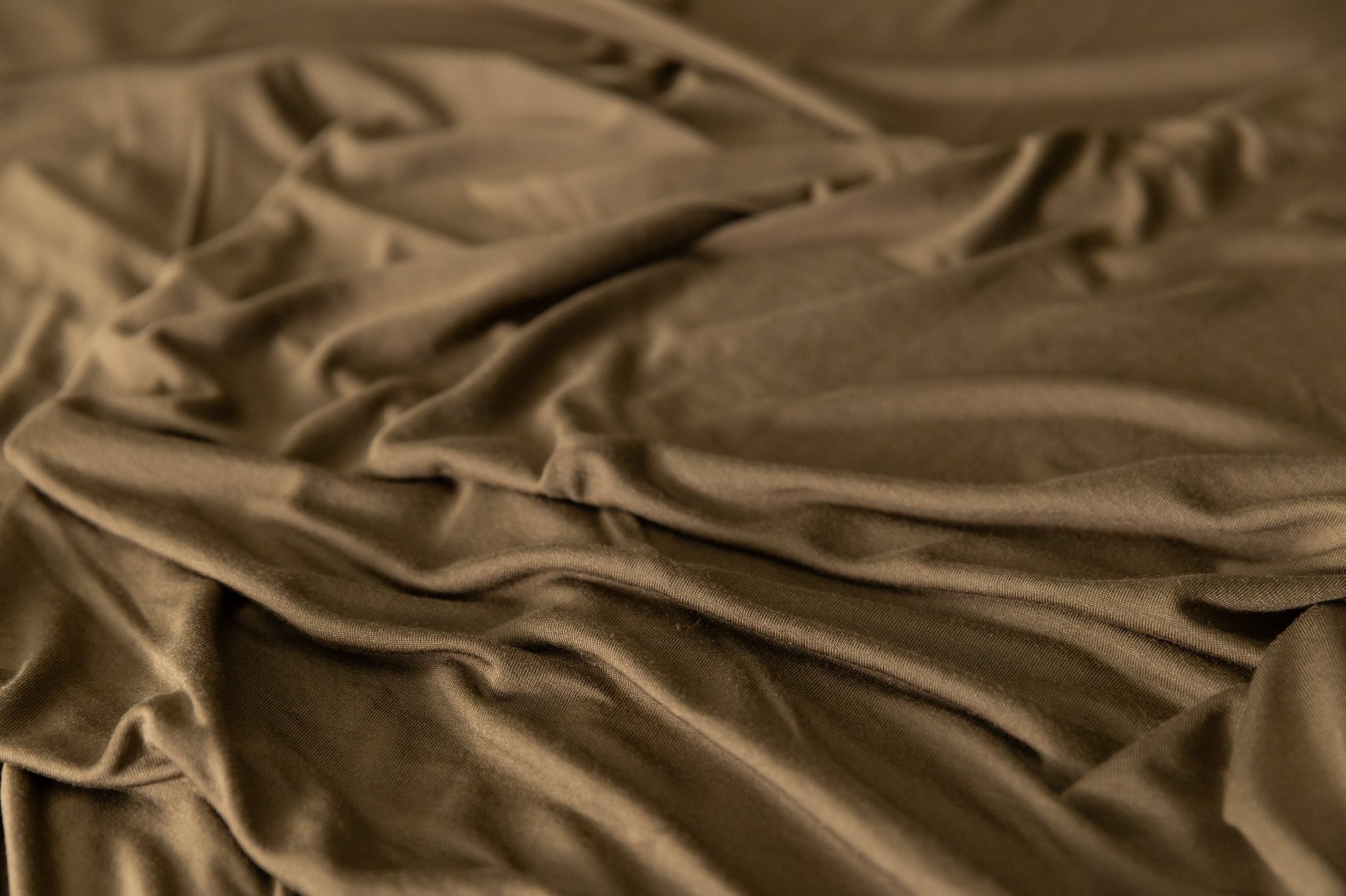 Close-up of crumpled brown jersey knit fabric
