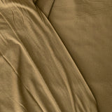 Close-up of forest green jersey knit fabric with visible texture