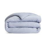 Folded light blue comforter png no background