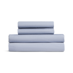 Set of light blue bed sheets stacked on a white background