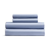 Set of light blue bed sheets stacked