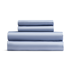 Set of light blue bed sheets stacked